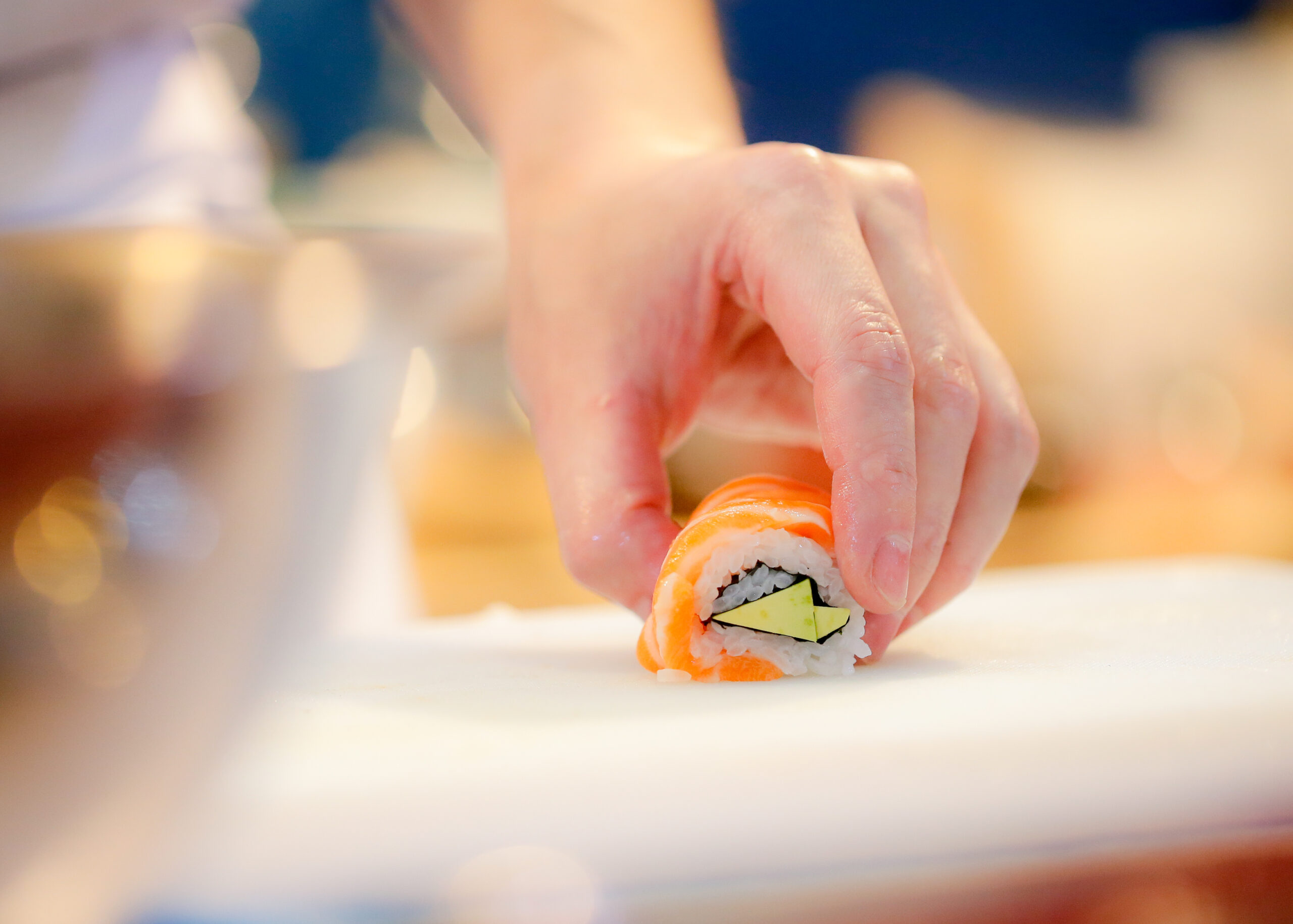 chef hands preparing japanese food, chef making sushi, Preparing Maki Sushi roll